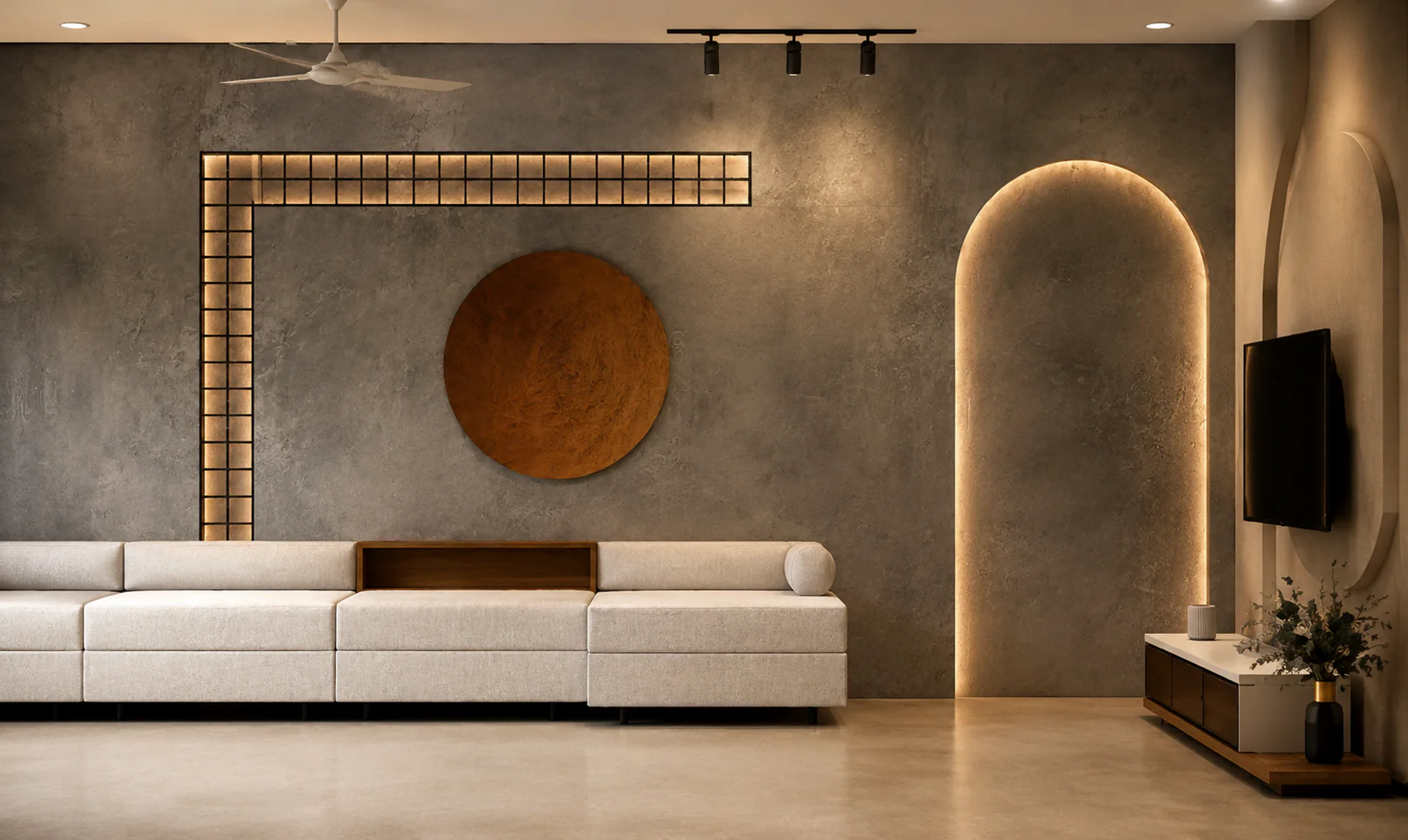 Warm residential living room with sculptural lighting and textured walls